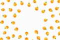 Fresh yellow cherry tomatoes scattered diagonally on a white background, creating a minimalistic and visually striking pattern.