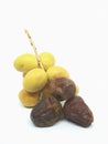 Fresh yellow dates and brown dates isolated on white background Royalty Free Stock Photo