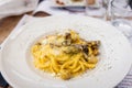 Fresh yellow heavy yolk Italian homemade fettucine pasta with truffles and sun dried tomatoes and an alfredo cream sauce Royalty Free Stock Photo