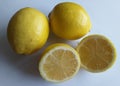 Fresh yellow lemon fruits, split in half Royalty Free Stock Photo