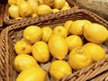 Fresh yellow lemon on shelf in vegetables and fruits area at Hypermarket, healthy concept Royalty Free Stock Photo
