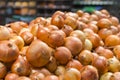 Fresh yellow onions as a background. Vegetable store. Yellow onion lies in a box in a store for sale Royalty Free Stock Photo