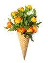 Fresh yellow-orange spray roses in a waffle cone on a white background. Copy space, flat lay Royalty Free Stock Photo