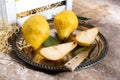 Fresh yellow pears on a silver platter. Sliced Pears