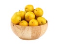 Fresh yellow plums in wooden bowl over white Royalty Free Stock Photo