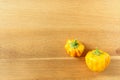 Fresh yellow scotch bonnet chili peppers on a wooden board with copy space Royalty Free Stock Photo