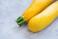 Fresh yellow squash on a pink background Royalty Free Stock Photo