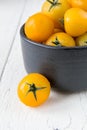 Fresh yellow tomatoes on white wooden table Royalty Free Stock Photo