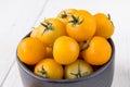 Fresh yellow tomatoes on white wooden table Royalty Free Stock Photo