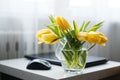 Fresh yellow tulips bouquet over wooden table. Isolated on white Royalty Free Stock Photo