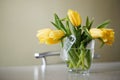 Fresh yellow tulips bouquet over wooden table. Isolated on white Royalty Free Stock Photo