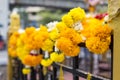 Fresh yellow and white flowers hanging at the spirits house.