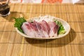 Fresh yellowtail sashimi - hamachi sashimi on bamboo mat