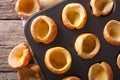 Fresh Yorkshire puddings in baking dish macro. horizontal top vi Royalty Free Stock Photo