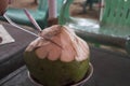 fresh young coconut that has been peeled and ready to serve. Young coconut water has many benefits to replace body ions