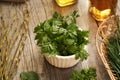 Fresh young cow parsley leaves on a table - a wild edible plant harvested in late winter Royalty Free Stock Photo