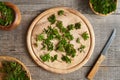 Fresh young ground elder leaves ona wooden cutting board