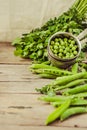 Fresh young organic peas on a wooden background. Selective focus Royalty Free Stock Photo