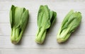 fresh and yummy green leaves Bok choy,Chinese cabbage ,small choy sum,on a white wooden Royalty Free Stock Photo