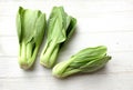 fresh and yummy green leaves Bok choy,Chinese cabbage ,small choy sum,on a white wooden Royalty Free Stock Photo