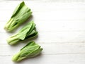 fresh and yummy green leaves Bok choy,Chinese cabbage ,small choy sum,on a white wooden Royalty Free Stock Photo