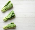 fresh and yummy green leaves Bok choy,Chinese cabbage ,small choy sum,on a white wooden Royalty Free Stock Photo