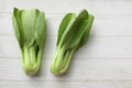 fresh and yummy green leaves Bok choy,Chinese cabbage ,small choy sum,on a white wooden Royalty Free Stock Photo