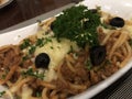 Fresh and yummy spaghetti with beef Bolognese sauce garnished with olives and parsley Royalty Free Stock Photo