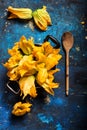 Fresh zucchini flowers inside vintage pan top view Royalty Free Stock Photo