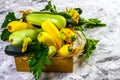 Fresh zucchini, green vegetables in a wooden box on local farmer market, freshly harvested courgette, summer squash Royalty Free Stock Photo