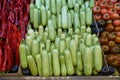 fresh zucchini in the greengrocer aisle, zucchini lined up for sale in large quantities