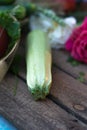 Fresh zucchini on a wooden old background with vegetables. Royalty Free Stock Photo