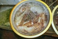 Freshest raw gourmet shrimps or prawns in bowl with clear water circulation for sale at typical asian seafood market.