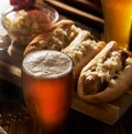 Freshlly poured IPA beer in mug served with bratwursts Royalty Free Stock Photo