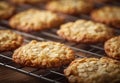 Freshly baked almond cookies cooling on a wire rack