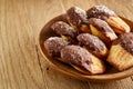 Freshly baked almond cookies piled on ceramic plate over rustic background, top view, close-up, selective focus Royalty Free Stock Photo