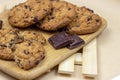 Freshly baked American chocolate chip cookies on rustic brown wooden table background. Royalty Free Stock Photo