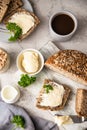 Freshly baked artisan multigrain bread with butter and pate. Breakfast with coffee, sliced bread, butter and liver pate. Light