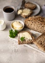 Freshly baked artisan multigrain bread with butter and pate. Breakfast with coffee, sliced bread, butter and liver pate. Light