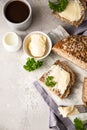 Freshly baked artisan multigrain bread with butter and pate. Breakfast with coffee, sliced bread, butter and liver pate