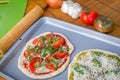 Freshly baked artisan pizza with fresh produce and cheese. Royalty Free Stock Photo