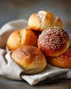 Freshly baked assorted bread rolls on cloth Royalty Free Stock Photo