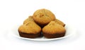 Freshly baked bran muffins on white plate Royalty Free Stock Photo