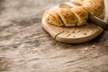 Freshly baked bread is cut into pieces on board Royalty Free Stock Photo