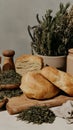 Freshly baked bread with dried herbs and rustic kitchen decor Royalty Free Stock Photo