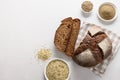 Loaf of freshly baked hemp bread and hempseeds on white background.