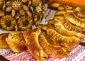 Freshly baked bread and rolls on a table. Isolated on a white background Royalty Free Stock Photo