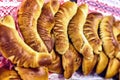 Freshly baked bread and rolls on a table. Isolated on a white background Royalty Free Stock Photo