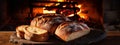 Freshly baked bread in rustic bakery with traditional oven. Food background.Generative AI Royalty Free Stock Photo