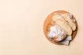 Freshly baked bread slices on cutting board against white wooden background. top view Sliced bread Royalty Free Stock Photo